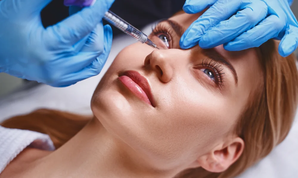 young-pretty-woman-is-preventing-age-by-visiting-cosmetologist-getting-botox-injections-into-face