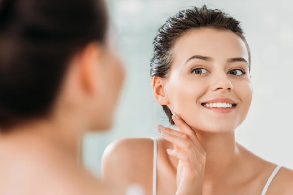 A women is checking her face after the radiant skin injection treatment in GLENDALE, AZ