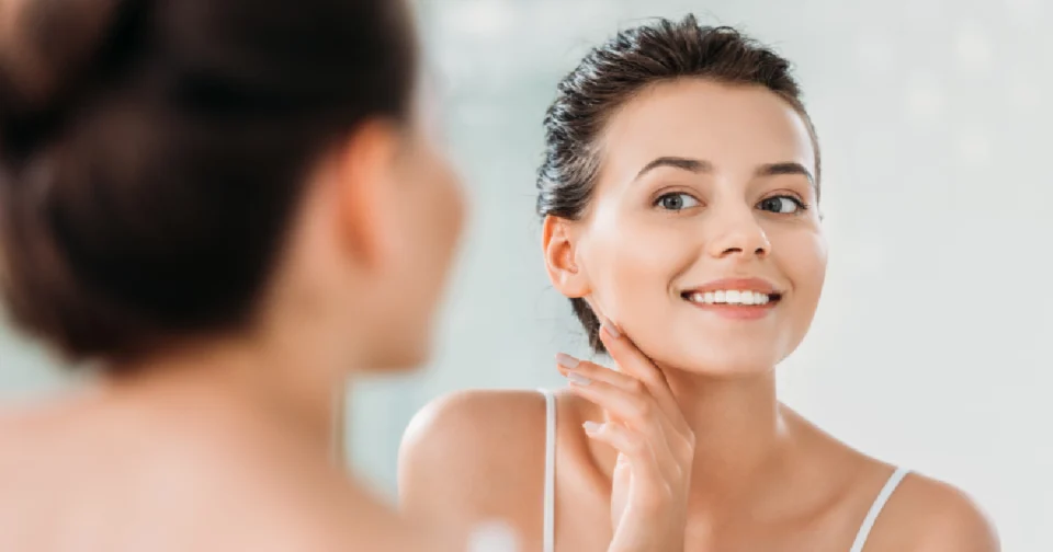 A women is checking her face after the radiant skin injection treatment in GLENDALE, AZ